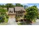 Picturesque two-story brick home with an attached garage, landscaped yard, and front porch at 265 Lily Cove Dr, Loganville, GA 30052