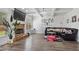 Bright living room featuring a fireplace, tray ceiling, and hardwood floors at 265 Lily Cove Dr, Loganville, GA 30052