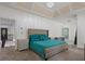 Main bedroom featuring a king bed and sitting area with a ceiling with recessed lighting at 265 Lily Cove Dr, Loganville, GA 30052