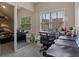 Office space with large mirror, desk, and natural light, providing a comfortable and productive work environment at 265 Lily Cove Dr, Loganville, GA 30052