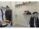 Walk-in closet with metal racks for easy and organized storage of clothing and other items at 265 Lily Cove Dr, Loganville, GA 30052