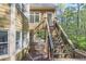 View of deck stairs, looking out into the wooded back yard at 2740 Stonehill Way, Cumming, GA 30041