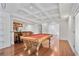 Finished basement with a pool table, coffered ceilings, and a wet bar at 2740 Stonehill Way, Cumming, GA 30041