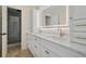 Luxurious bathroom with dual sinks, marble countertop, and glass-enclosed shower at 2740 Stonehill Way, Cumming, GA 30041