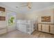 Bright bedroom with modern ceiling fan and a loft bed over built-in storage drawers at 2740 Stonehill Way, Cumming, GA 30041