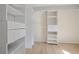 Organized closet with white shelving and drawers for ample storage space at 2740 Stonehill Way, Cumming, GA 30041