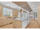 Modern kitchen with a large island, sleek cabinetry, and stylish pendant lighting at 2740 Stonehill Way, Cumming, GA 30041