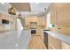 Bright kitchen featuring a large island, custom cabinetry, and stainless steel appliances at 2740 Stonehill Way, Cumming, GA 30041