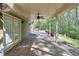 Large patio with brick flooring, ceiling fan, and doors leading to the backyard at 2740 Stonehill Way, Cumming, GA 30041