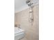 Modern bathroom featuring stylish tilework, a showerhead, and soaking tub at 572 Edgewood Ne Ave # 301, Atlanta, GA 30312