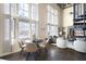 Open-concept living space with high ceilings, lots of natural light, and comfortable seating arrangements at 572 Edgewood Ne Ave # 301, Atlanta, GA 30312