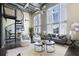 Bright living room with high ceilings, spiral staircase, and large windows offering ample natural light at 572 Edgewood Ne Ave # 301, Atlanta, GA 30312