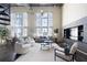 Open-concept living room with high ceilings, natural light, modern furnishings, and spiral staircase at 572 Edgewood Ne Ave # 301, Atlanta, GA 30312