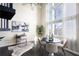 Bright living area featuring a soaring window, modern furnishings, and stylish decor at 572 Edgewood Ne Ave # 301, Atlanta, GA 30312