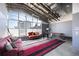 Bright living room with large windows, concrete floors, and exposed ductwork at 572 Edgewood Ne Ave # 301, Atlanta, GA 30312