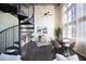 Bright living area featuring spiral staircase, dining table, and large windows at 572 Edgewood Ne Ave # 301, Atlanta, GA 30312