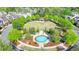 Beautiful neighborhood common with fountain, green space, mature trees, and charming gazebo for outdoor relaxation at 6425 Bellmoore Park Ln, Johns Creek, GA 30097