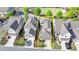 An aerial view of the house showing the fenced backyard and surrounding neighborhood at 6425 Bellmoore Park Ln, Johns Creek, GA 30097