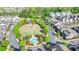 Enjoy a lush common area in this neighborhood featuring mature trees, a gazebo, and relaxing green space at 6425 Bellmoore Park Ln, Johns Creek, GA 30097