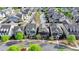 A high-angle shot of a lovely neighborhood with sidewalks and tree-lined streets at 6425 Bellmoore Park Ln, Johns Creek, GA 30097
