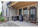 Charming back porch with stone pavers, string lights, and access to the yard at 6425 Bellmoore Park Ln, Johns Creek, GA 30097