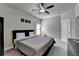 Modern bedroom featuring a ceiling fan and natural light at 6425 Bellmoore Park Ln, Johns Creek, GA 30097