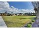 The lawn in the community with lush green grass, walkways, and garden area at 6425 Bellmoore Park Ln, Johns Creek, GA 30097