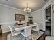 Elegant dining area featuring modern furniture, stylish decor, and a bright, inviting atmosphere at 6425 Bellmoore Park Ln, Johns Creek, GA 30097