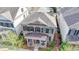 Beautiful brick home with a covered front porch and well-maintained landscaping at 6425 Bellmoore Park Ln, Johns Creek, GA 30097