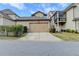 Spacious two-car garage with an extended private driveway and manicured landscaping at 6425 Bellmoore Park Ln, Johns Creek, GA 30097