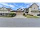 Two-car garage with private driveway in a suburban neighborhood setting at 6425 Bellmoore Park Ln, Johns Creek, GA 30097