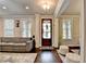 Inviting living room with hardwood floors, natural light, and open layout for comfortable living at 6425 Bellmoore Park Ln, Johns Creek, GA 30097