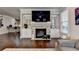 Bright living room features a fireplace, stylish decor, and plenty of space for entertaining at 6425 Bellmoore Park Ln, Johns Creek, GA 30097