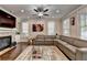 Cozy living room featuring a fireplace, mounted TV, and a modern design, perfect for relaxing at 6425 Bellmoore Park Ln, Johns Creek, GA 30097