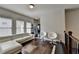 Bright living room featuring hardwood floors, a white sofa, and modern decor at 6425 Bellmoore Park Ln, Johns Creek, GA 30097