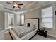 Spacious bedroom with neutral walls, large windows, and doorway to the bathroom at 6425 Bellmoore Park Ln, Johns Creek, GA 30097