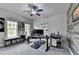 Home office space with fan, gray walls, and a large desk perfect for remote work at 6425 Bellmoore Park Ln, Johns Creek, GA 30097
