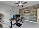 Cozy office space with fan and a decorative wood wall at 6425 Bellmoore Park Ln, Johns Creek, GA 30097