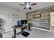 Cozy office space with fan and a decorative wood wall at 6425 Bellmoore Park Ln, Johns Creek, GA 30097