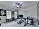 Home office space with fan, gray walls, and a large desk perfect for remote work at 6425 Bellmoore Park Ln, Johns Creek, GA 30097