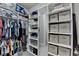 Spacious walk-in closet with custom shelving and ample storage space for organization at 6425 Bellmoore Park Ln, Johns Creek, GA 30097