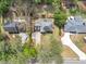 Aerial view of the roof of the home with a manicured yard, a patio, and a long driveway at 1960 Barnes Mill Rd, Marietta, GA 30062