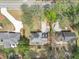 An aerial view shows well-maintained lawns, paved driveways, and mature tree coverage at 1960 Barnes Mill Rd, Marietta, GA 30062
