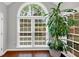 Bright room featuring a large arched window and lush greenery outside at 1960 Barnes Mill Rd, Marietta, GA 30062