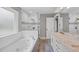 Bathroom features a soaking tub, separate glass-enclosed shower, and double vanity at 1960 Barnes Mill Rd, Marietta, GA 30062