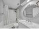 Bathroom featuring shower-tub combination, updated tile and vanity at 1960 Barnes Mill Rd, Marietta, GA 30062