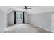 Bedroom features neutral paint, large window and ceiling fan at 1960 Barnes Mill Rd, Marietta, GA 30062
