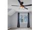 Bedroom features vaulted ceiling, fan, and large window with backyard view at 1960 Barnes Mill Rd, Marietta, GA 30062