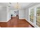 Bright dining room featuring hardwood floors, an elegant chandelier, and large windows at 1960 Barnes Mill Rd, Marietta, GA 30062