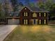 Charming two-story brick home with black shutters, dormer windows, and a well-manicured front lawn at 1960 Barnes Mill Rd, Marietta, GA 30062
